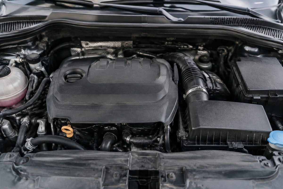 Engine compartment showing the cover and intake layout